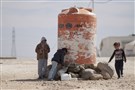 Water Management in Jordan in Response to the Syrian Crisis: Between Neoliberal Pressures and Social Tensions