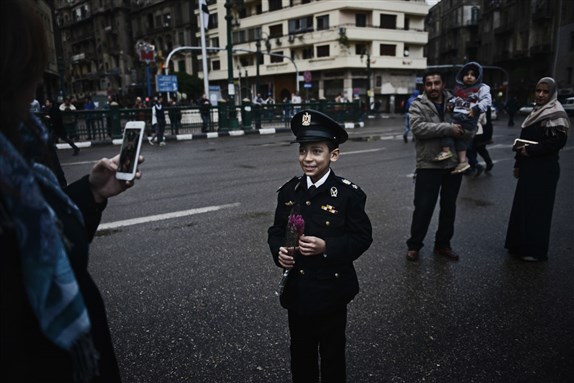 An Egyptian child with a police costume in Tahrir square. January 25, 2016 (Photo by Jonathan Rashad)