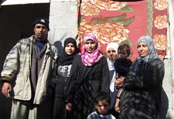 [Saeed and Nisreen al-Rahel with their children Dina, Sunia, Ansam, Anas and Ali. Image from pchrgaza.org.]