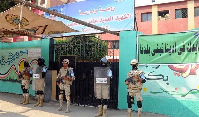 [Egyptian troops secure voting sites in the first round of the 2015 legislative elections. Photo from the official Facebook Page of the Spokesperson of the Egyptian Armed Forces]