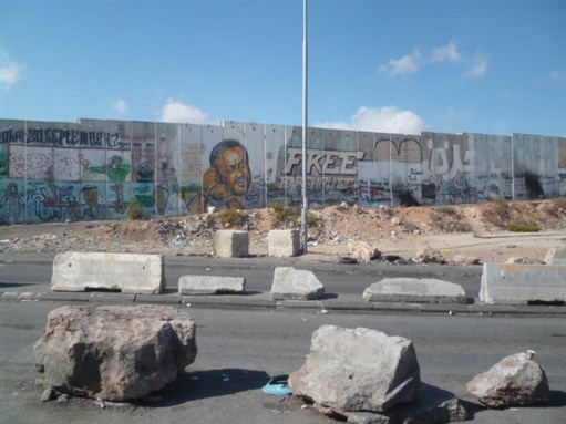 [Image of the separation wall in the West Bank. Image by Labour Palestine, via Flickr.]