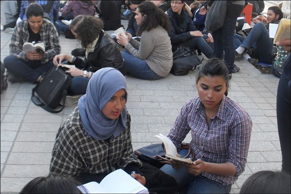 [Tunisian students celebrate World Book Day by reading on Bourguiba Avenue. Image by Houda Trabelsi/Magharebia]