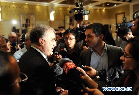 [Luis Moreno-Ocampo, the Chief Prosecutor of the International Criminal Court, answers questions after the joint press conference with Libya`s Interim Justice Minister Mohammed al-Allagui in Tripoli on Nov. 23, 2011. Image from Xinhua/Qin Haishi.]