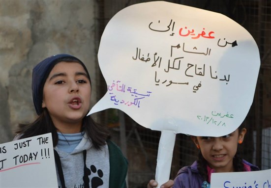 [\"From Afrin to Damascus, we want polio vaccines for all children in Syria!\" The Takhi Kurdish LCC in `Afrin, Syria.]