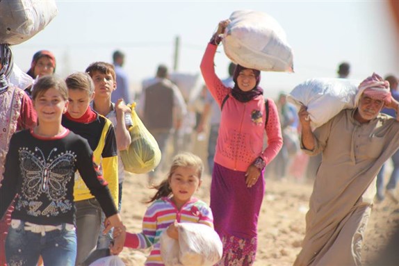 [Massive influx of Syrian Kurdish refugees into Turkey. Photo by European Commission DG ECHO via Flickr]