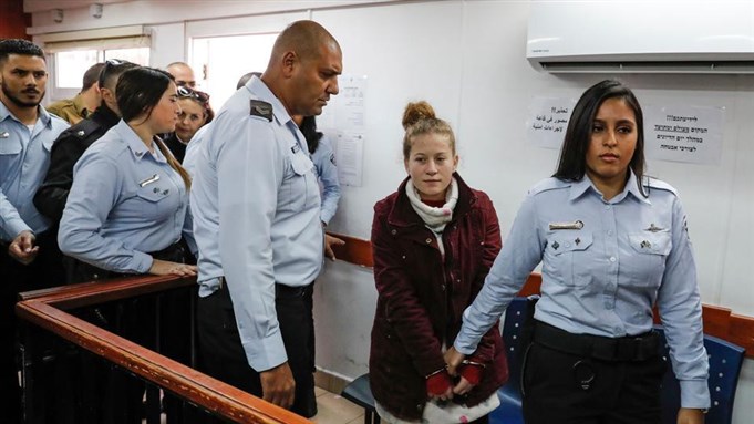 [Ahed Tamimi, a sixteen-year-old Palestinian rights campaigner, appears at a military court which extended her detention, at the Ofer prison in the West Bank. Source: Medium.com@SIPTU]