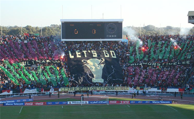 Fans of Rabat's ASFAR soccer team show their support in a match.