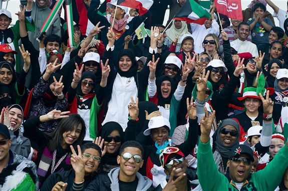Kuwaiti youth celebrating Kuwait's independence, 2011. Via Wikimedia Commons.