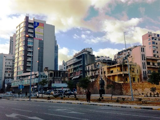 Bechara El-Khoury Crossing in Beirut, a former frontpost on the demarcation line, where bullet ridden ruined buildings are gradually superseded by speculative real estate. Credit: Eric Verdeil, 2019 (Creative Commons)