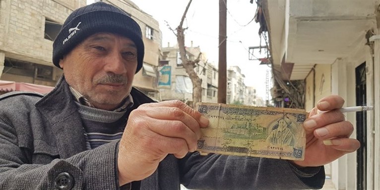 De-valued currency. Photo credit: Maher al-Mounes.