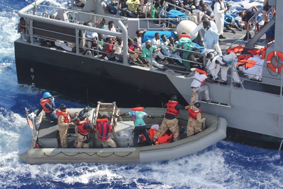 Distressed refugees rescued and transferred to Maltese patrol vessel. October 17, 2013. (Wikimedia Commons)