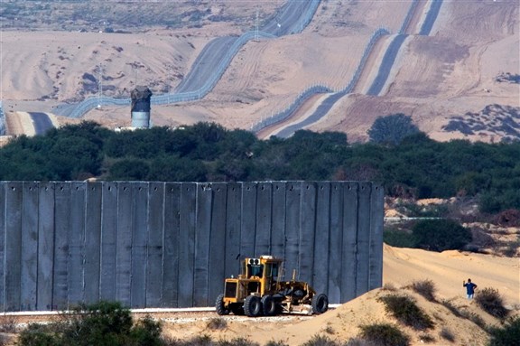 The separation wall between Israel and Gaza Strip. By ChameleonsEye via Shutterstock.