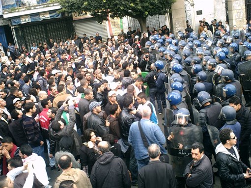 Thousands of police confront protestors in central Algiers in 2011. Photo by Nazim Fethi via Flickr