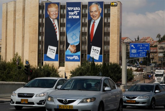 An Israeli election banner for the Likud party showing US President Donald Trump shaking hands with Likud chairman and Prime Minister Benjamin Netanyahu on a Building in Jerusalem Israel 9 September 2019. Image via Shutterstock.