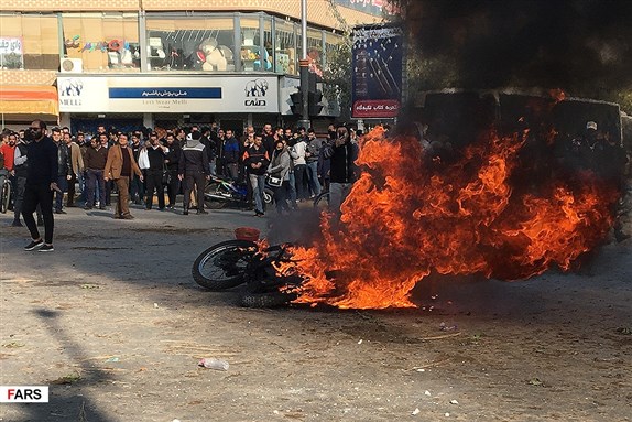 Iranians Protesting the Hike in Fuel Prices. Image from Fars News via Wikimedia Commons.