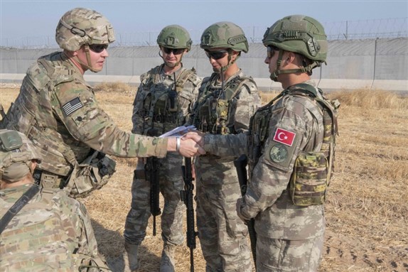 U.S. and Turkish troops rendezvous for a joint patrol in the Northern Syria Buffer Zone, 4 October 2019. Image via Wikimedia Commons by Andrew Goedl.