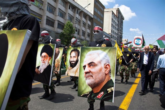 Quds Day rally, Parade of military forces, along with photographs of Qasem Soleimani, Iran Tehran, 31 May 2019. Image via Shutterstock.