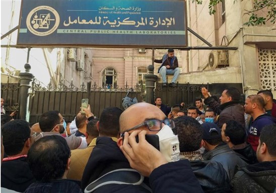 Egyptians gather in front of the Central Public Health Laboratories in downtown Cairo as they wait to get tested for Coronavirus March 8, 2020. (via AFP) 
