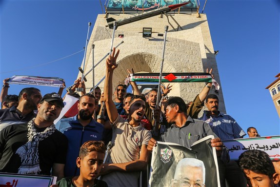 Palestinians participate in a protest rally against the agreement to establish diplomatic ties between Israel and the United Arab Emirates, in Rafah the southern Gaza Strip, on August 20, 2020.