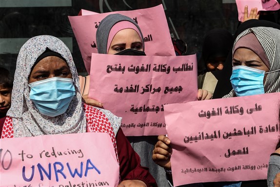 Palestinians take part in a march to protest the reduction of the food basket provided by the United Nations Relief and Works Agency for Palestine Refugees (UNRWA) in Gaza Strip, on Oct 14, 2020 via Shutterstock