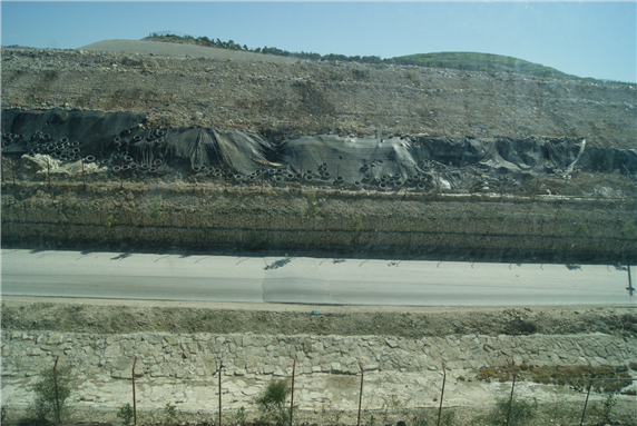 Side view of the PA-run Zahrat al-Finjan landfill near Jenin from its administrative offices, 2010. Credit: Author.
