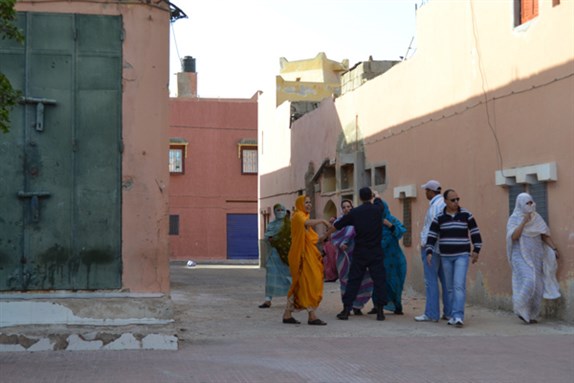 [Uniformed police officer attacking nonviolent protestor. Laayoune, Aug. 25, 2012. Image by Mariah Kennedy-Cuomo/Huffington Post.]