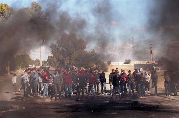 [Young unemployed revolting in the town Nasrallah, in Tunisia in January 2016. Image by Marko Ionnqvist, via Flickr.]