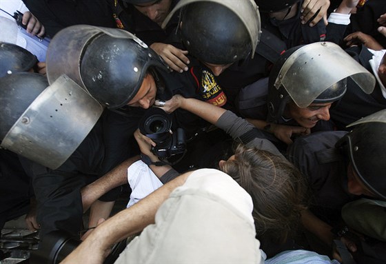 [Riot police stop media from entering a public court. Photo by Muhammad Ghafari via Flickr.]