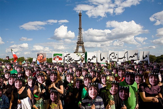  [Paris, 2009: protesters holding the poster of Neda Agha-Soltan , photo by Reza Deghati via Flicker]