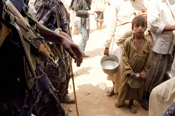 [Al-Mazraq, Yemen Oct. 9, 2009. A boy waits in line for food at the Mazraq refugee camp in Hajjah province. Taken by IRIN Photos, uploaded from Flickr]