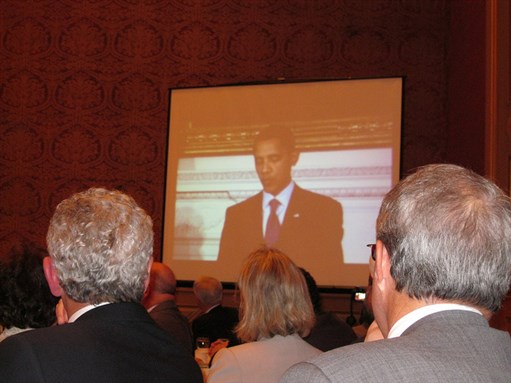[Guests at the Association of Progressive Muslims of Canada`s Eid Ul-Fitr Dinner on Parliament Hill Watch President Obama`s White House Iftar, 2010. Image by US Embassy, Canada.]