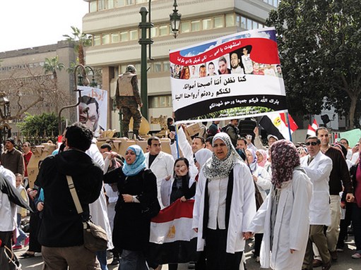 [Thousands of doctors and nurses march peacefully down Qasr Al Aini Street, Cairo on February 11th. Image originally posted to Flickr by Darla Hueske.]