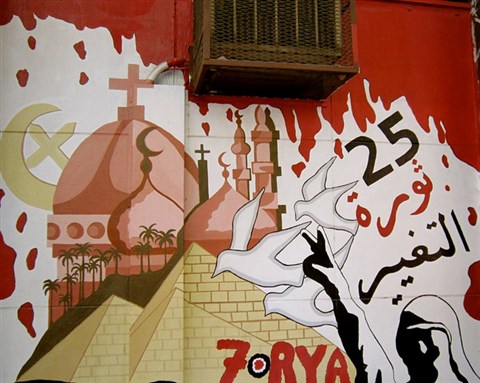 [The Arabic reads: \"Revolution of change\" and \"Freedom\". Photo by Gigi Ibrahim via Flickr]