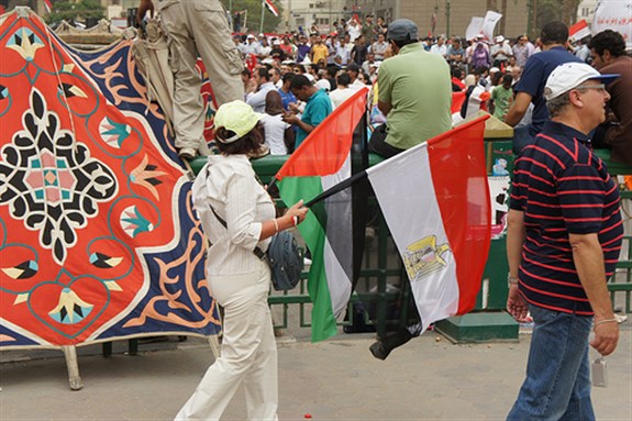 [Egyptians carrying Palestinian flags. Image originally posted to Flickr by Zeinab Mohamed.]