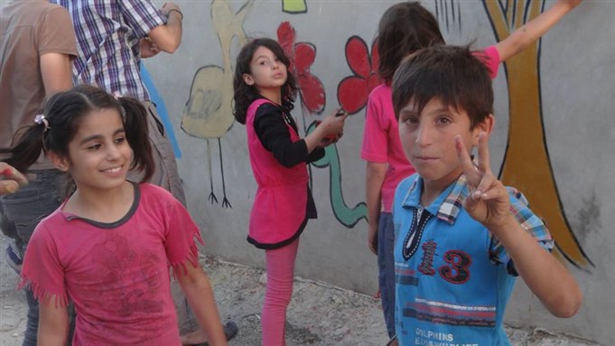[Children painting in Saraqeb. 5 June 2013. From Saraqeb Walls.]
