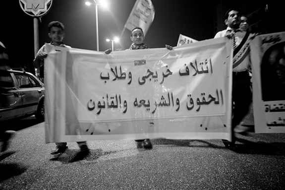[Maspero protestors marching back to Tahrir. Image originally posted to Flickr by Hossam el-Hamalawy.]
