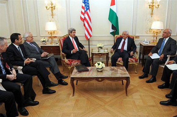 [U.S. Secretary of State John Kerry and his team sit with Palestinian Authority President Mahmoud Abbas before a meeting in Paris, France, on February 19, 2014.  Image by US Department of State.]