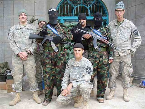 [Members of the US 1st Battalion 9th Infantry Division posing with members of the Sofia Militia in Iraq. Image by Gonzo13fox via Wikimedia Commons]