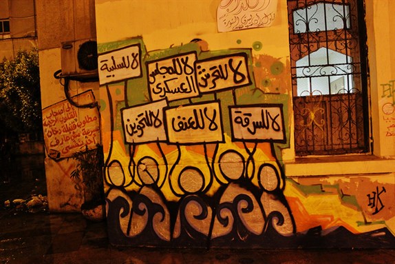 [\"No to sexual harassment, no to SCAF, no to passiveness, no to theft, no to violence,\" graffiti in Tahrir Square. Image by Mostafa Sheshtawy, via Flickr.]