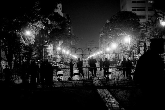 [31 January 2012, police shut down all roads leading to the parliament. Photo by Hossam el-Hamalawy via Flickr]