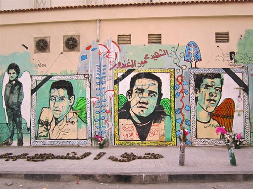 [Graffiti of Port Said martyrs. Photo by Gigi Ibrahim via Flickr]