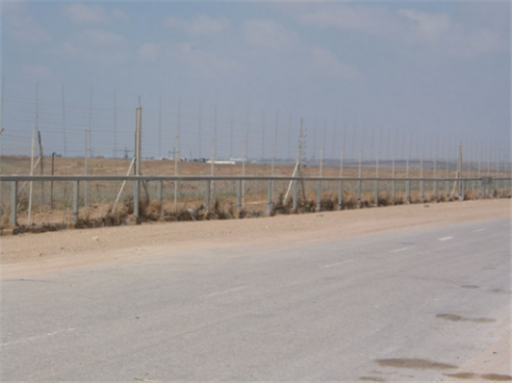 [A fence encircling Gaza, taken in 2005.]
