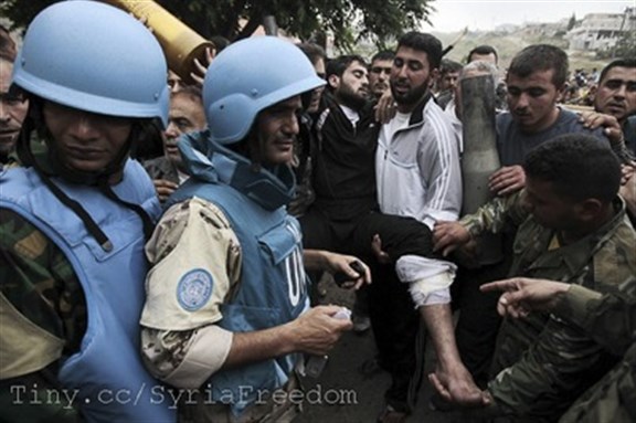 [UN Monitors are shown injured Syrians. Image by FreedomHouse2 via Flickr] 