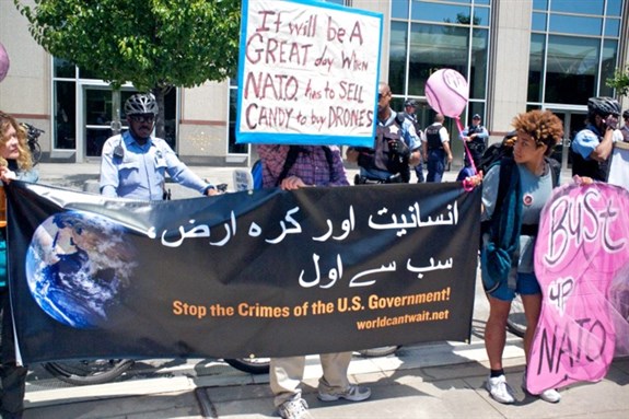 [Protest for victims of US drone strikes, downtown Chicago, Illinois. Image by Debra Sweet.]
