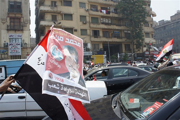 [Supporters of Mohamed Morsi celebrate his victory in Tahrir Square. Image originally posted to Flickr by Zeinab Mohamed.]