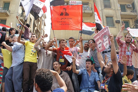 [Mohamed Mursi supporters support his initial victory in the presidential elections. Image originally posted to Flickr by Zeinab Mohamed.]