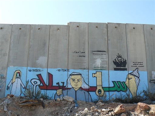 [Graffiti on the separation wall in the West Bank. Image by \"Monsieur Cana\", via Wikimedia Commons.]