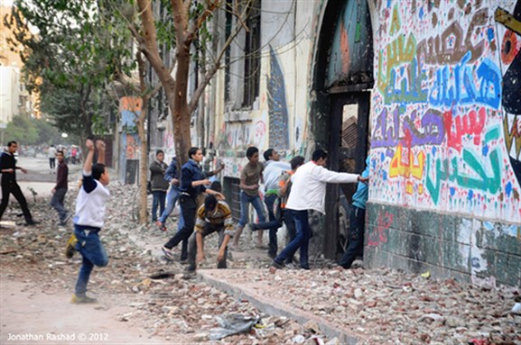 [Protesters attacking police in Tahrir on November 26th. Image originally posted to Flickr by Jonathan Rashad.]