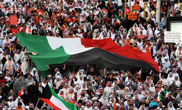 [Tens of thousands march in Kuwait on 30 November 2012. Image from Flickr/Kuwait-Ra`ed Qutena.]