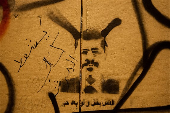 [Graffiti on the walls of the Presidential Palace in Cairo. Image originally posted to Flickr by Hossam el-Hamalawy.]